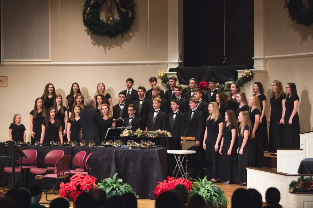 The high school choir singing at the Christmas concert