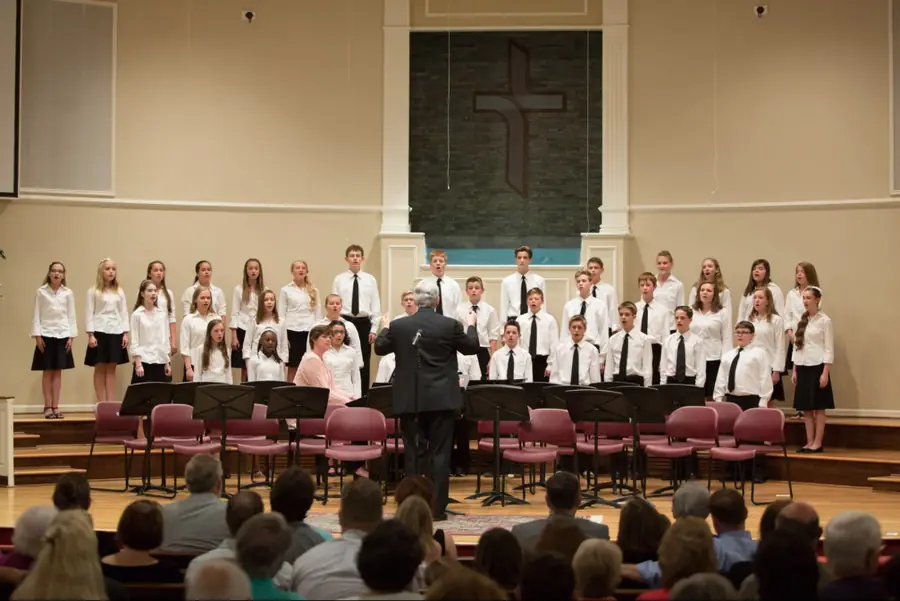 The WCA choir performing in the sanctuary under the cross