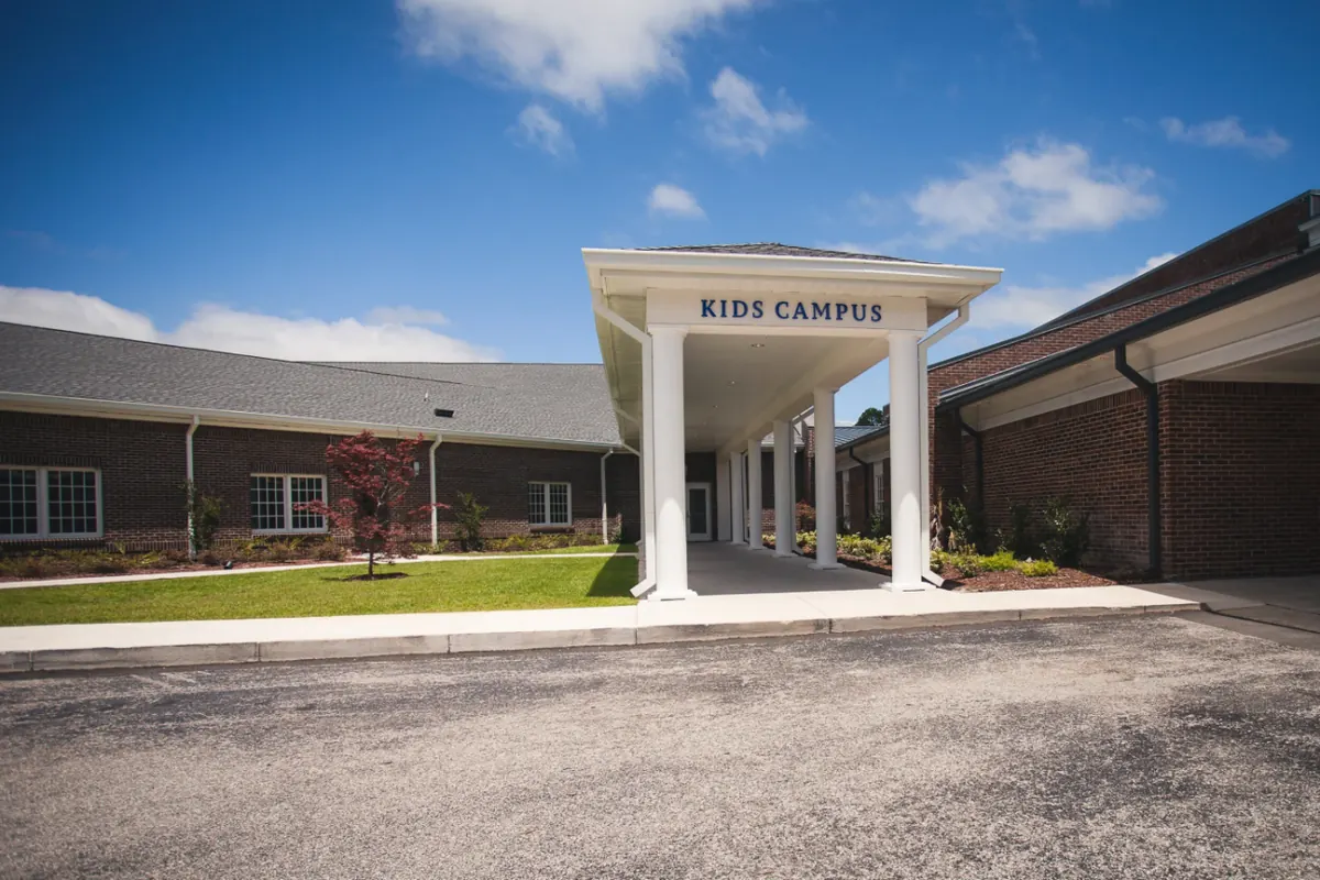 The covered entrance of the WCA Kids Campus building
