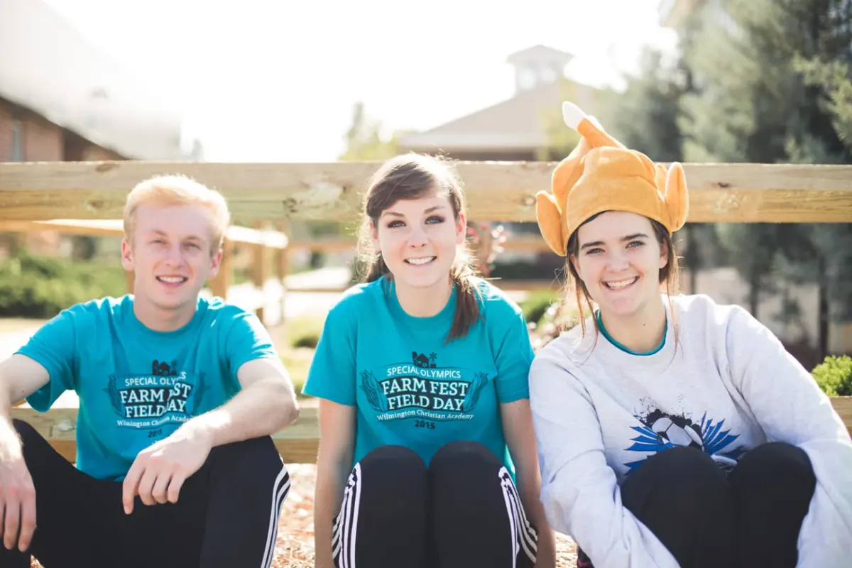 Three WCA students in Special Olympics Farm Fest Field Day T-shirts
